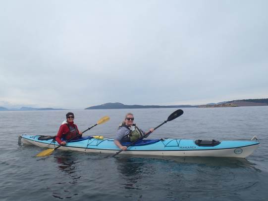 Rosanne Parry and Lindsay Moore in a sea kayak.